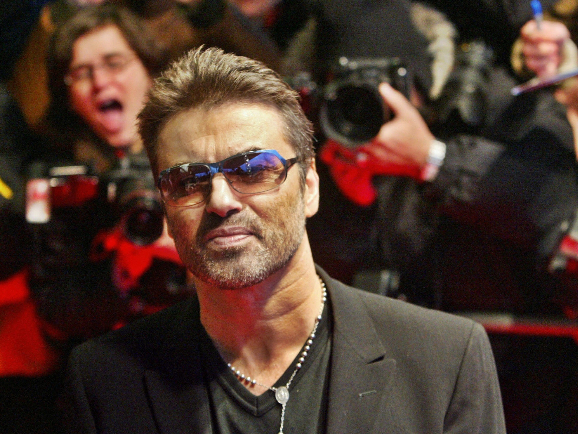 New Royal Mint coin design shows a likeness of George Michael with his trademark sunglasses