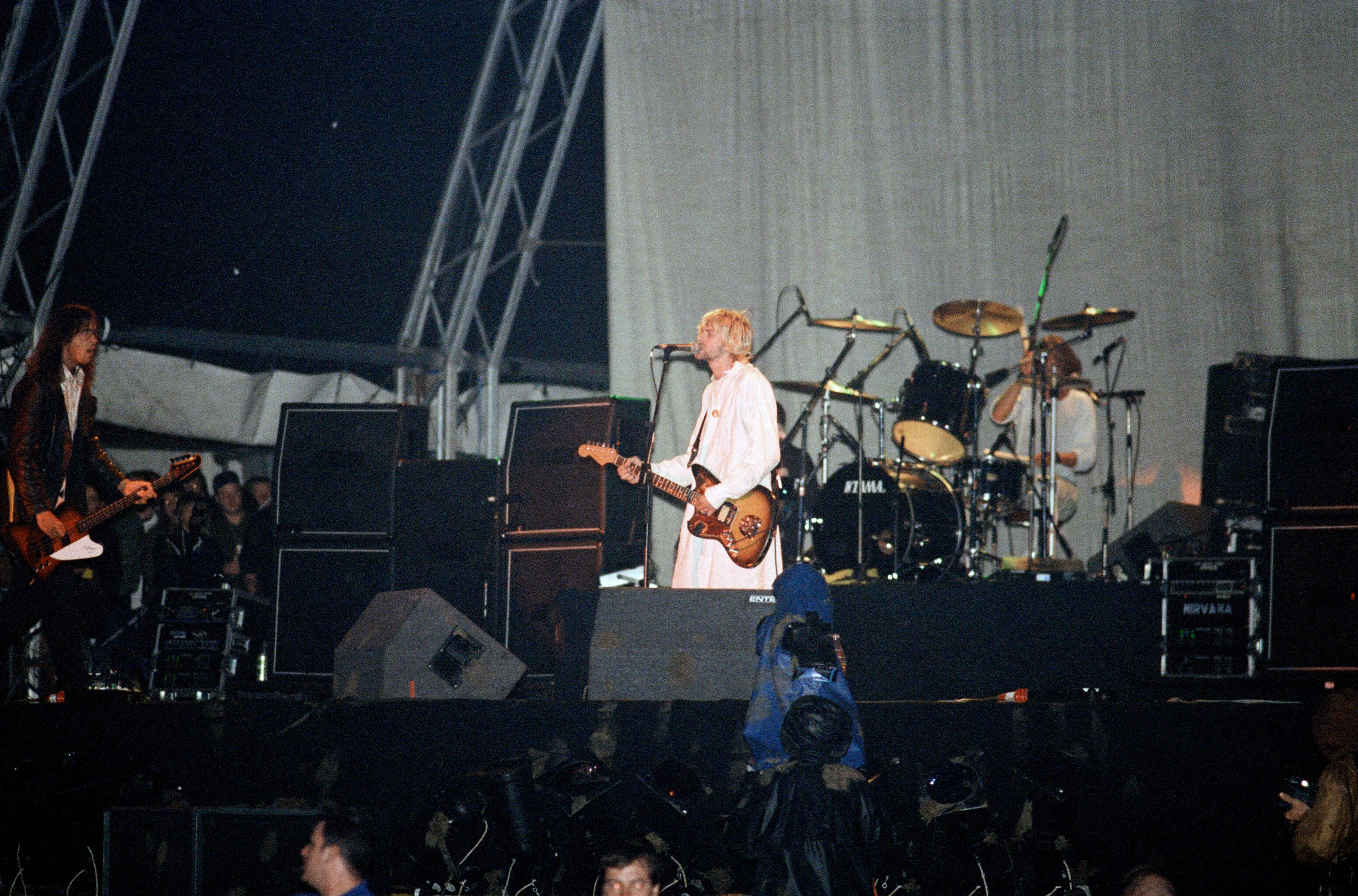 Kurt Cobain of Nirvana performing in a hospital gown at Reading 1992