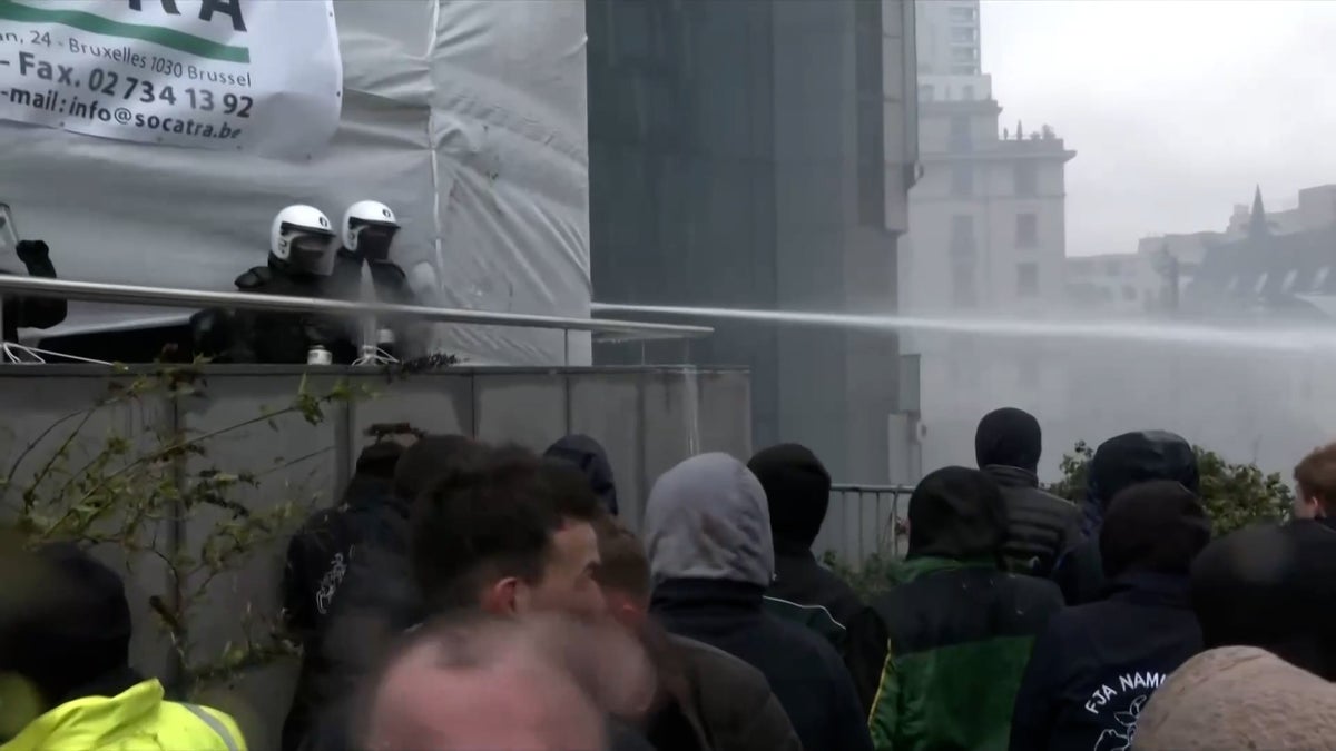 Water cannon fired as police clash with protesting farmers in Brussels