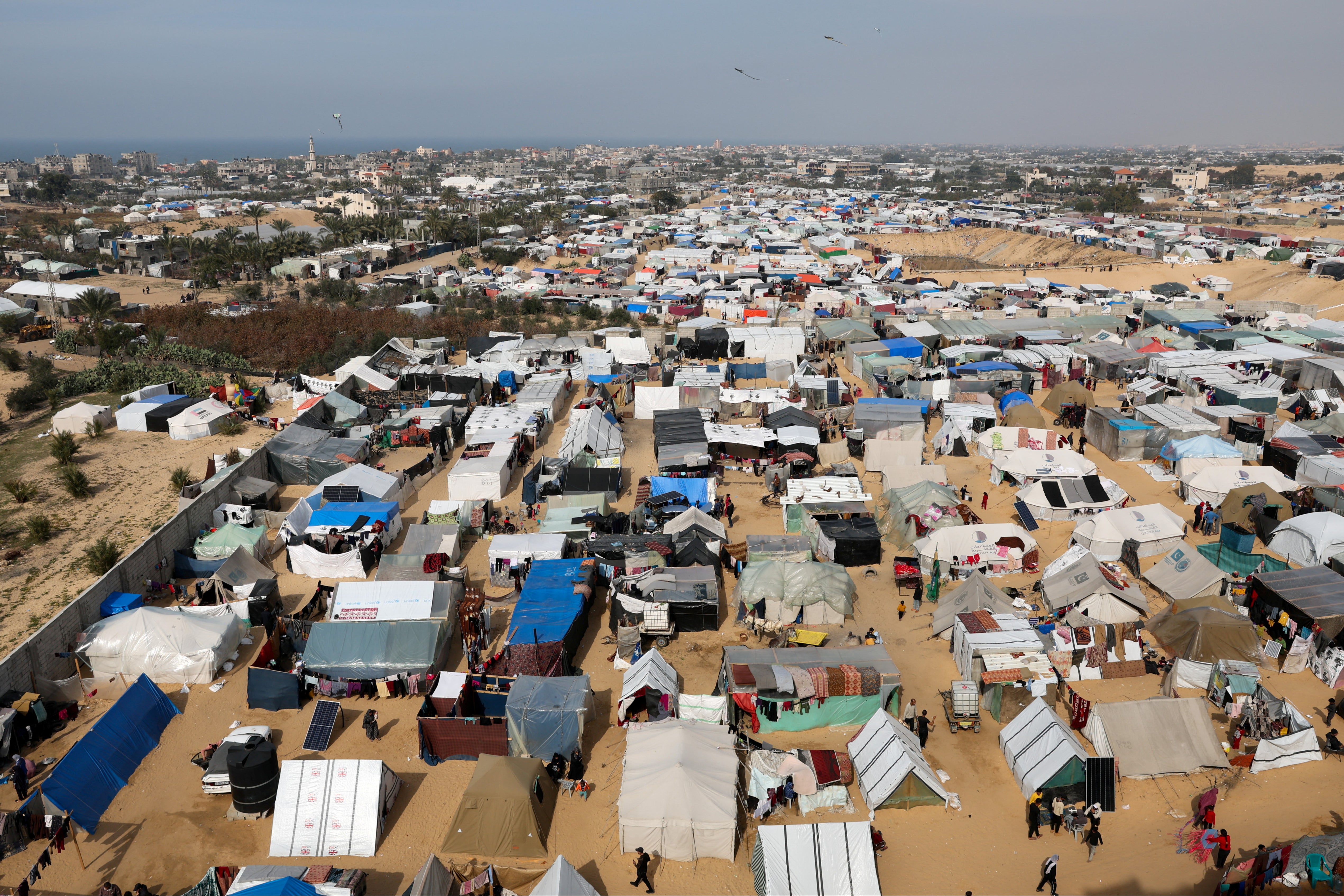 Palestinians sheltering in a tent camp in Rafah