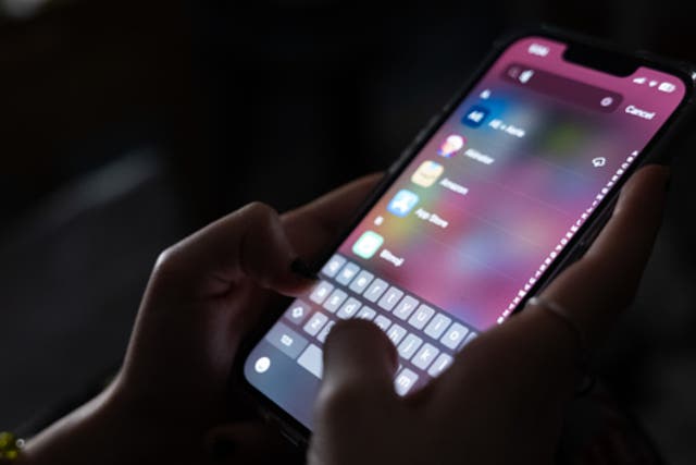 <p>In this photo illustration, a teenager uses her mobile phone to access social media on January 31, 2024 in New York City</p>