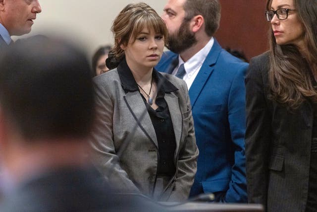 <p> Hannah Gutierrez-Reed walks back to her seat after speaking with District Judge Mary Marlowe Sommer before her trial on 26 February 2024</p>