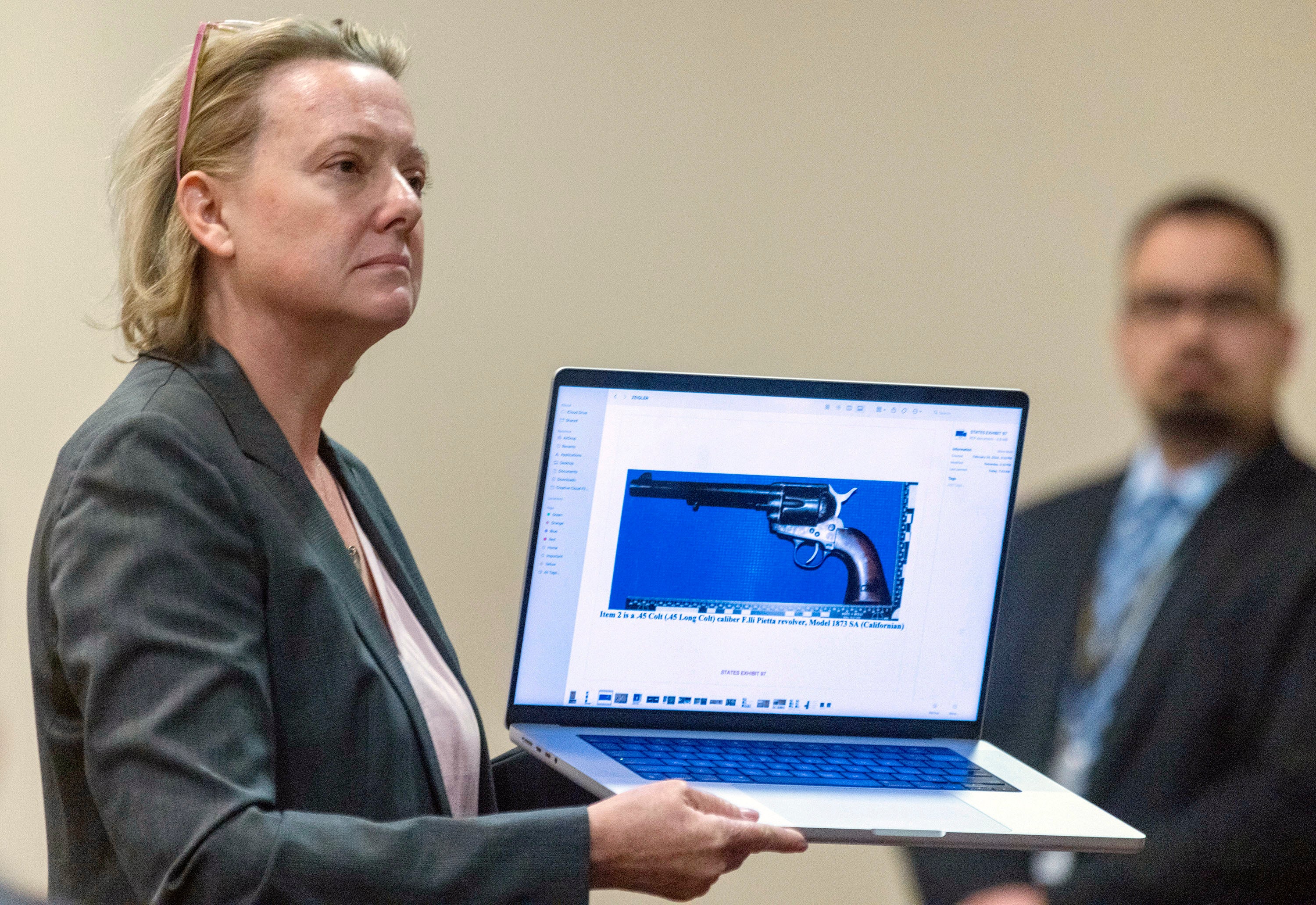 Special prosecutor Kari Morrissey shows defense attorney Jason Bowles a picture of a firearmReed during Hannah Gutierrez-Reed trial at District Court, Monday, Feb. 26, 2024, in Santa Fe, New Mexico