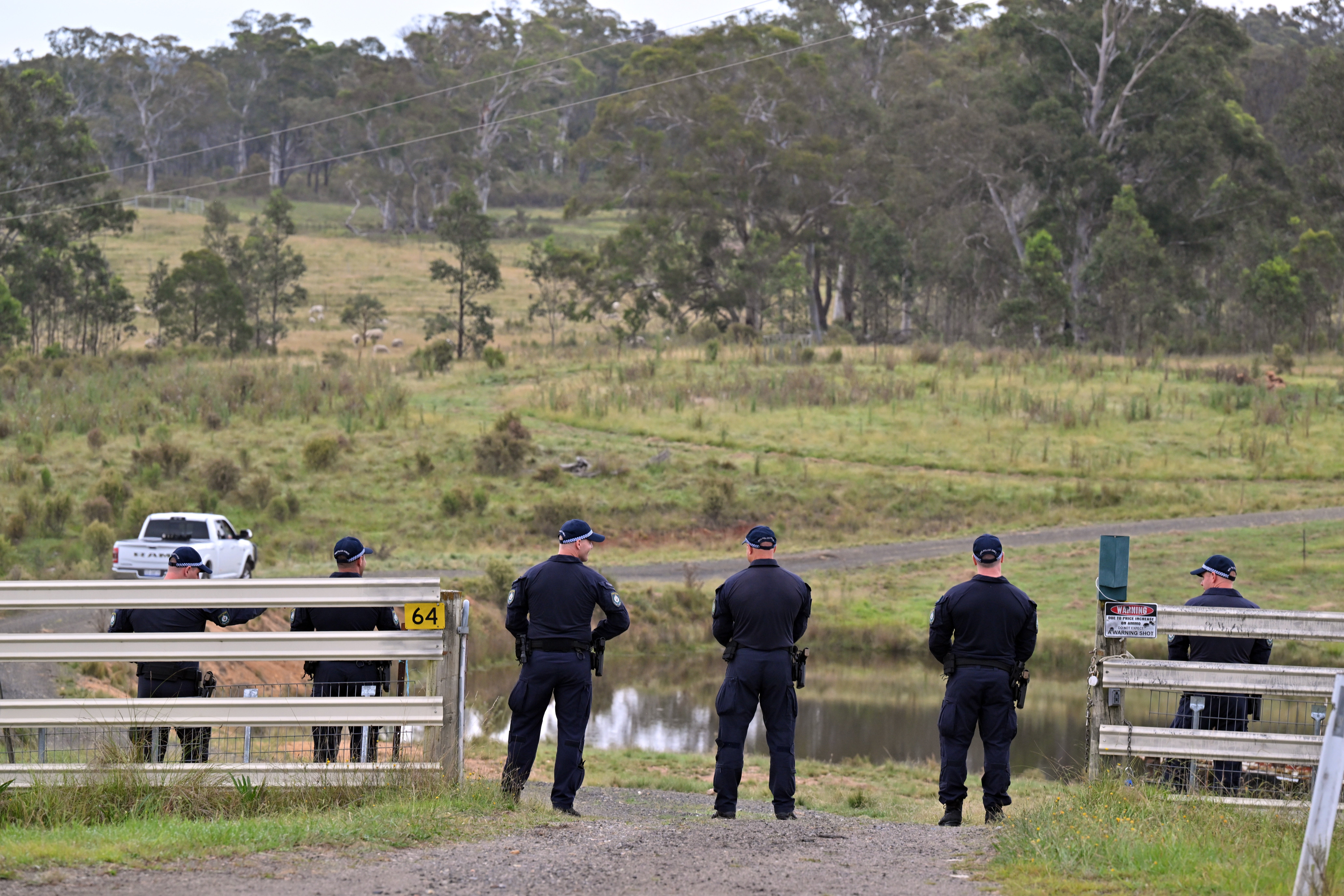 New South Wales police conduct a line search on a rural property on Hazelton Road in Bungonia