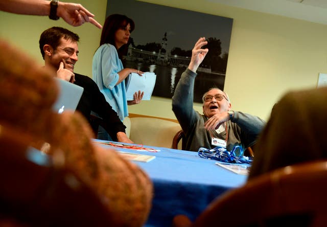 <p>A patient affected by Alzheimer’s disease gestures as he attends a special therapeutic session in Madrid on November 28, 2017</p>