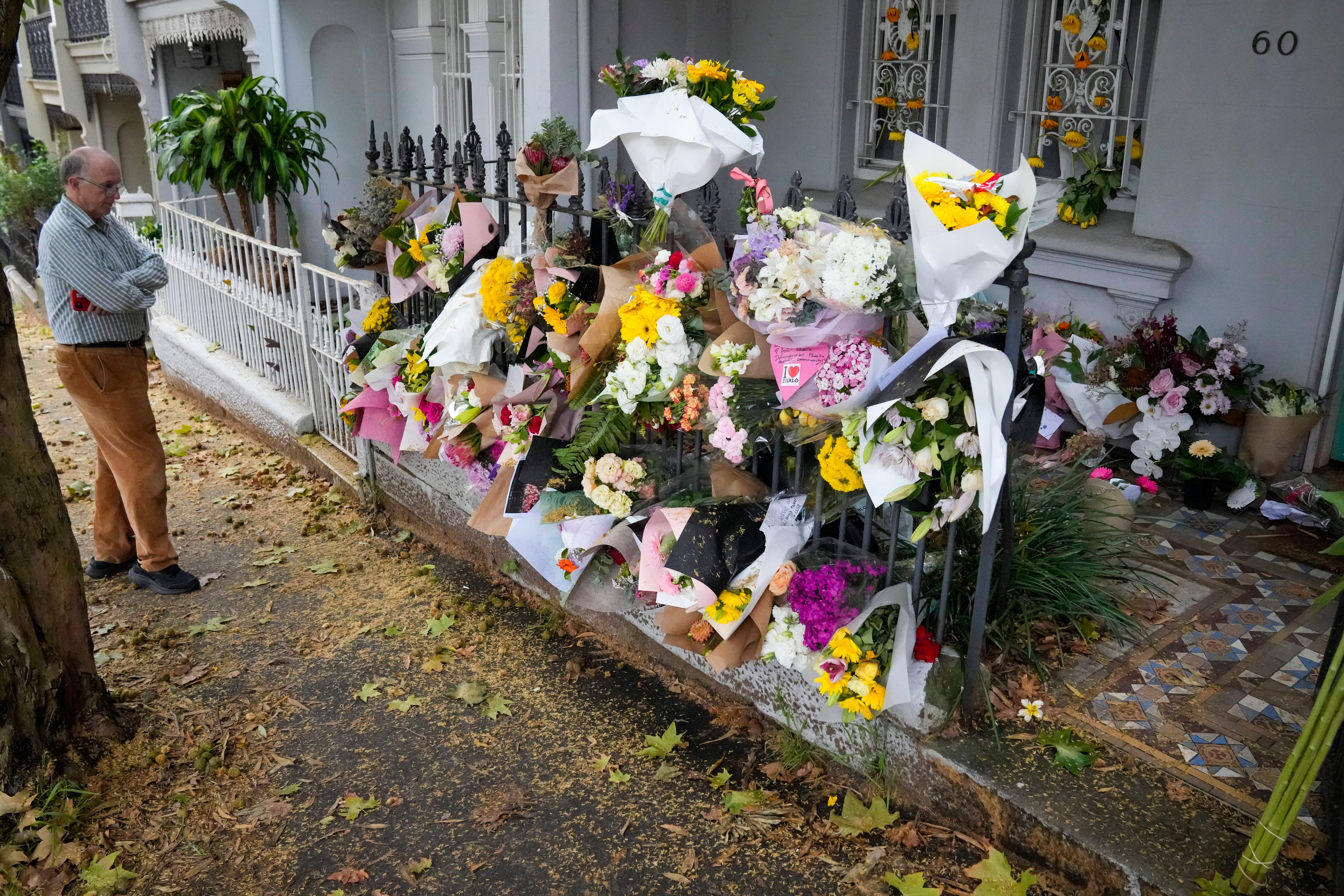 A man stands outside the Paddington residence of Jesse Baird in Sydney on Tuesday