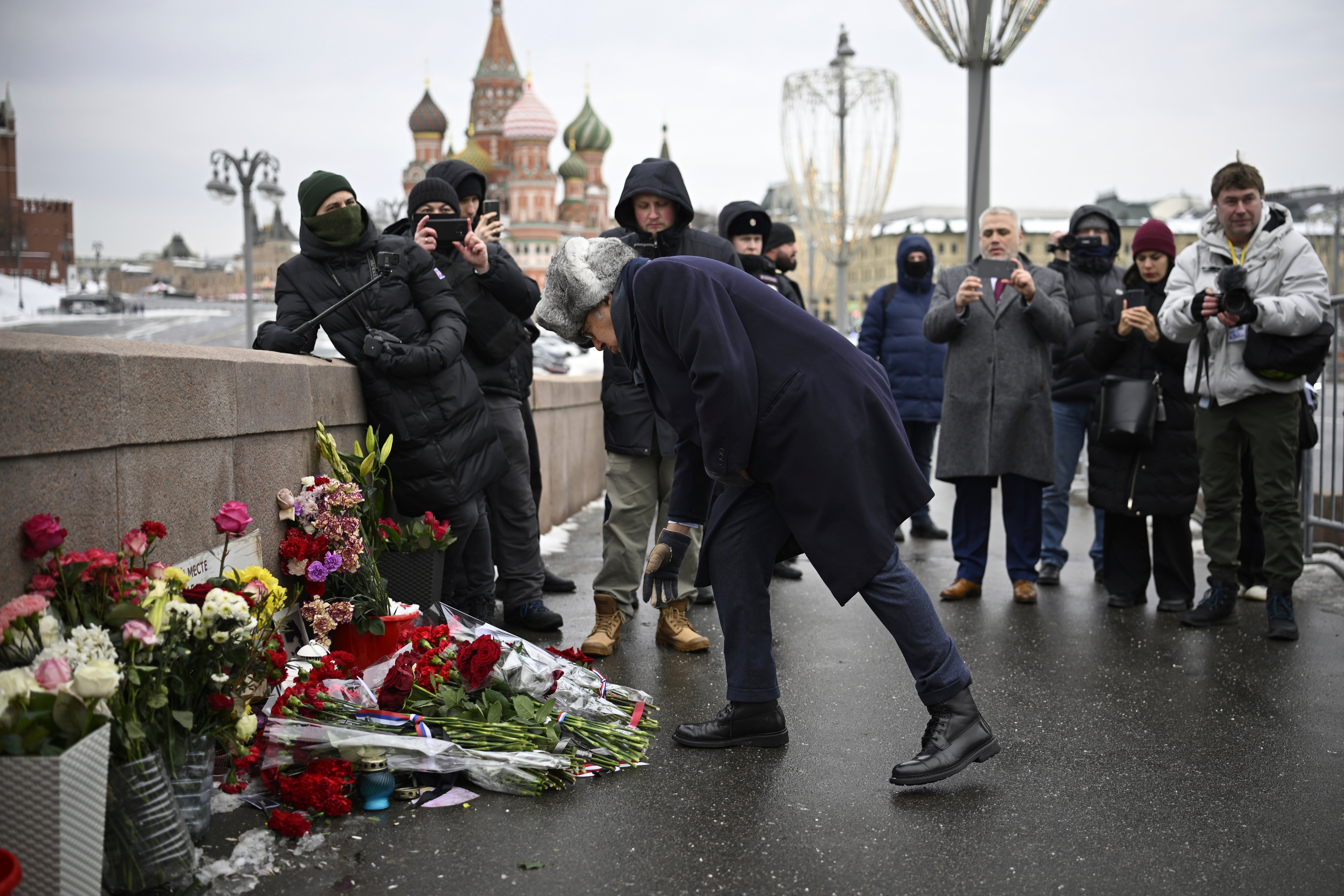 French Ambassador to Russia Pierre L'vy lays flowers at the place where Russian opposition leader Boris Nemtsov was gunned in 2015
