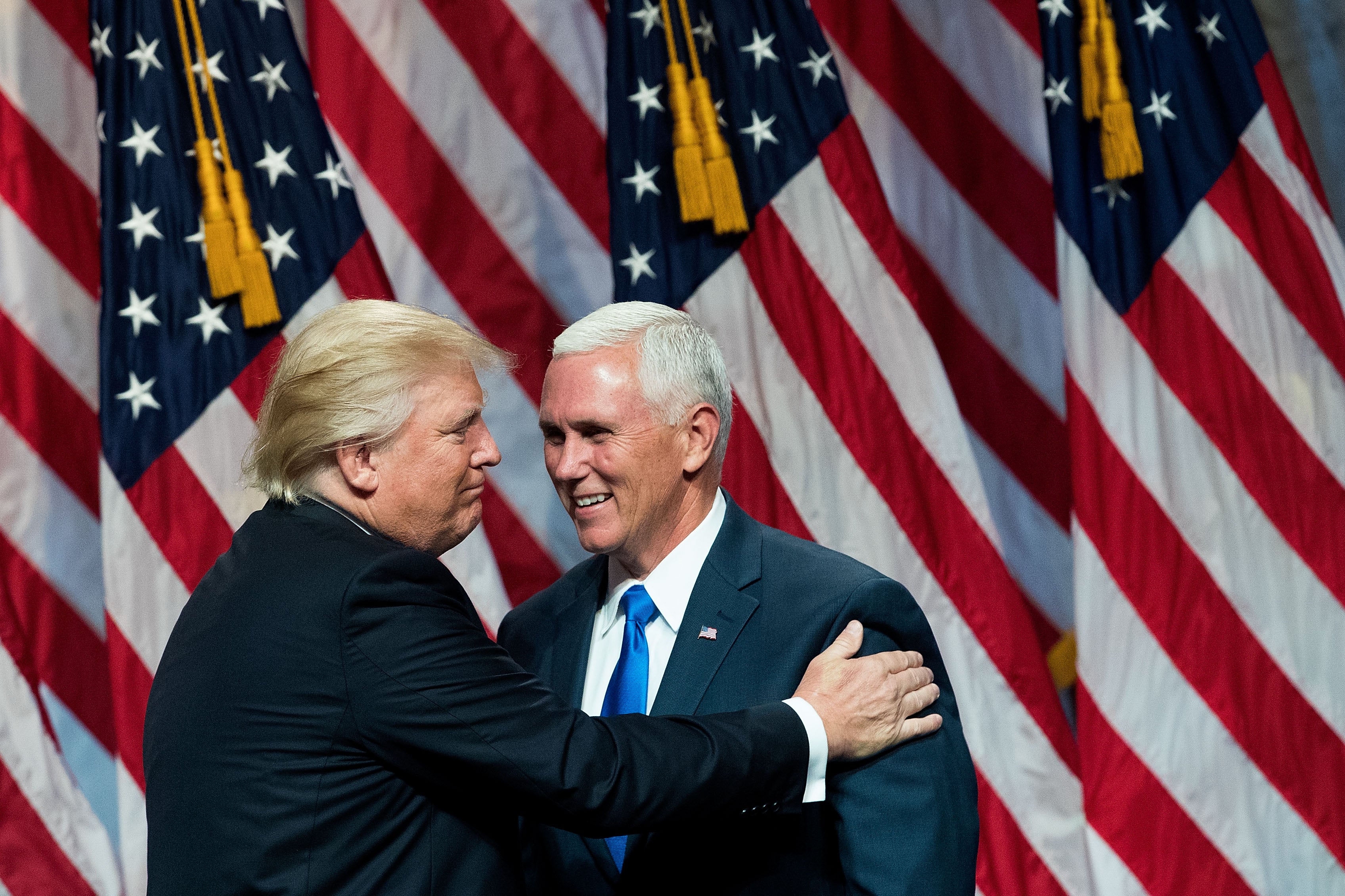 Republican presidential candidate Donald Trump introduces his newly selected vice-presidential running mate Mike Pence, governor of Indiana, on 16 July 2016