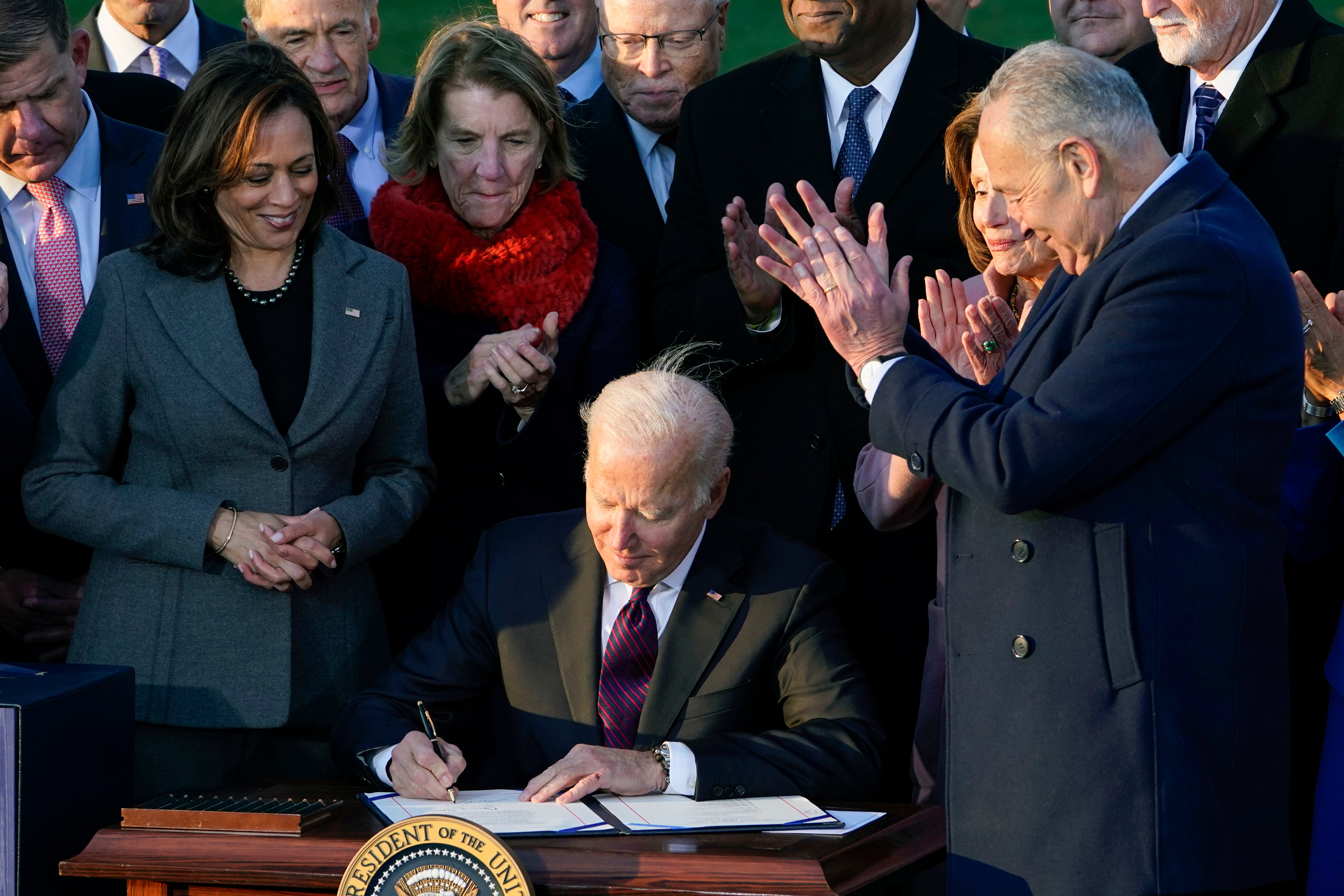 President Joe Biden signs the $1.2 trillion bipartisan infrastructure bill into law during a ceremony on the South Lawn of the White House in Washington, Nov. 15, 2021