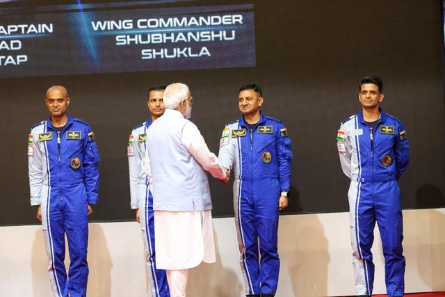 <p>Indian prime minister Narendra Modi hands over hand over token wings to four Indian astronaut-designates</p>