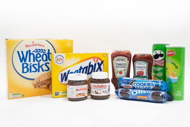 A line-up of well-known consumer brands alongside products sold by Aldi of (left to right) Wheat Bisks and Weetabix cereal, Nutella and Nutoka chocolate spread, Heinz tomato ketchup and Bramwells tomato ketchup, sour cream and onion Pringles and Snackrite crisps, and original Oreos and Belmont Cookies and Cream biscuits. Aldi’s high-profile legal spats with its brand rivals are stacking up as the discounter’s thriving UK customer base continues to expand. The latest trademark infringement claim against Aldi, by Thatchers Cider, has been dismissed in the High Court, landing a blow for brands which may be considering similar defences of their products. Picture date: Thursday January 25, 2024.