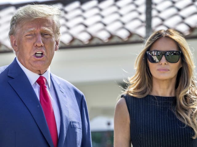 <p>Donald and Melania Trump walk out of a polling station in Palm Beach, Florida, after voting in the 2022 midterm elections</p>