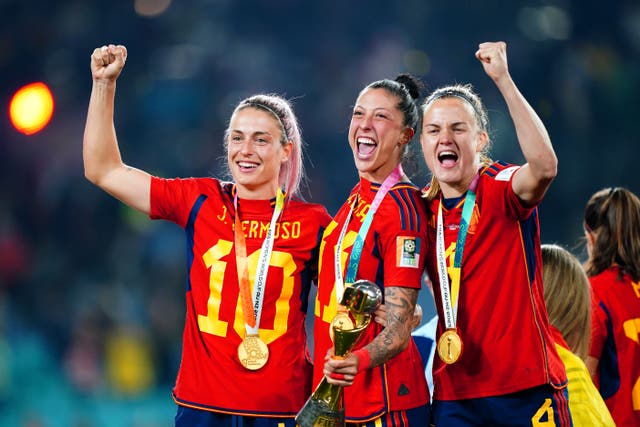 Spain’s Jenni Hermoso, centre, celebrates with team-mates Alexia Putellas, left, and Irene Paredes after winning the FIFA Women’s World Cup (Zac Goodwin/PA)