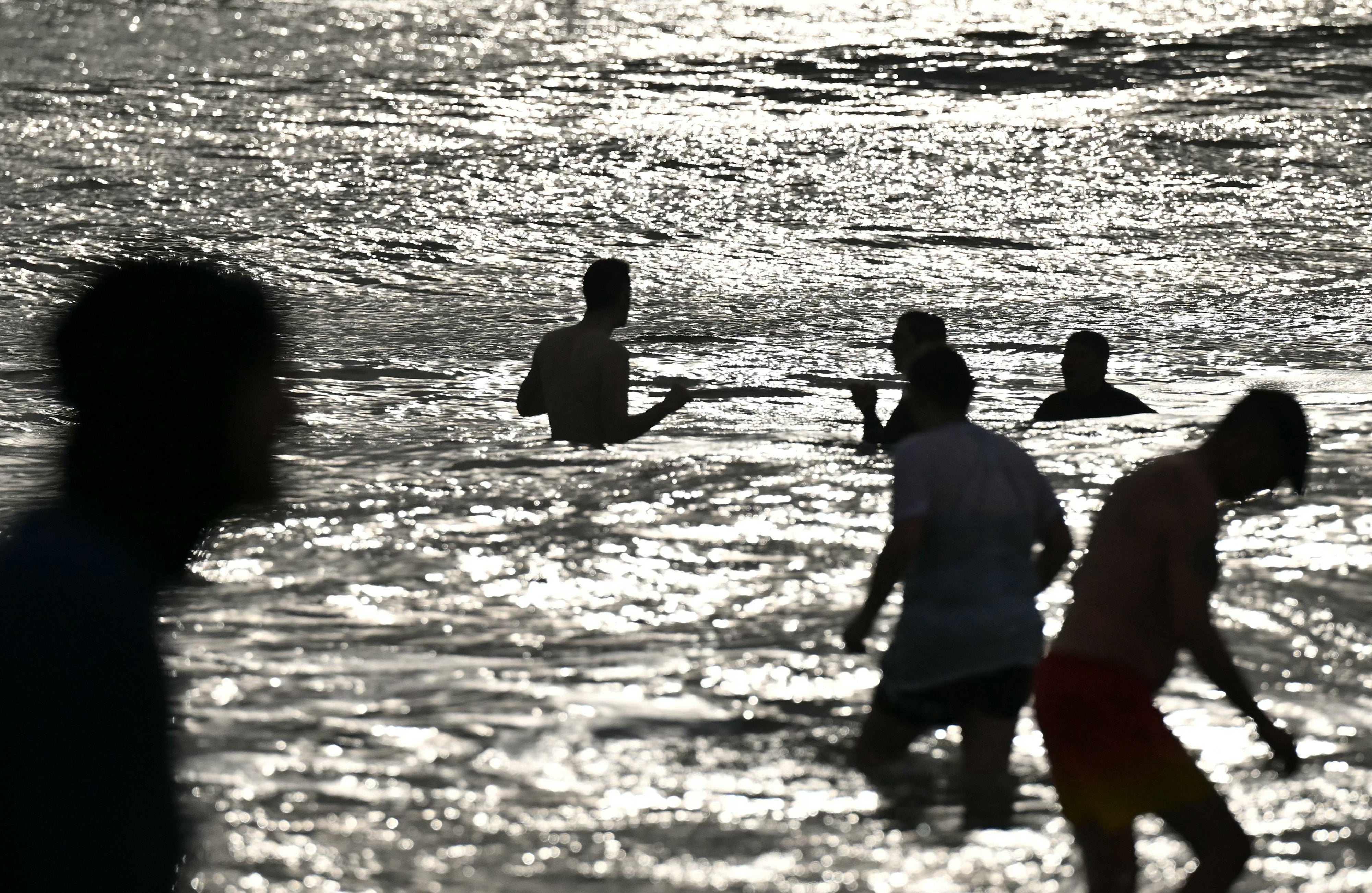 File image: People bathing on the beach. The study says water forecast models, currently in use at over 600 designated bathing locations in the UK, are insufficient to ensure public safety