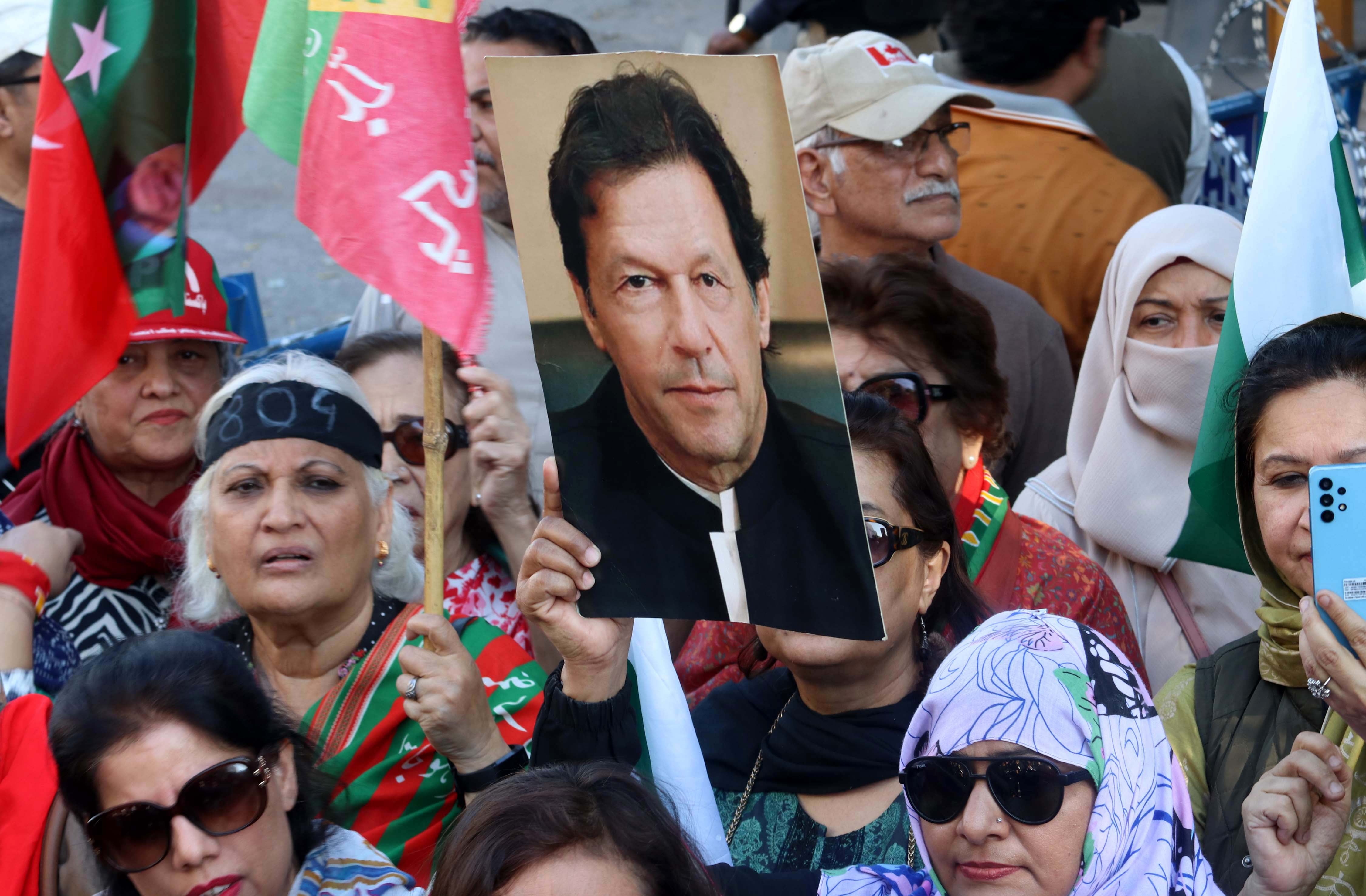 Supporters of the Pakistan Tehrik-e-Insaf (PTI) political party gather to protest against alleged rigging in the general elections, in Karachi, Pakistan