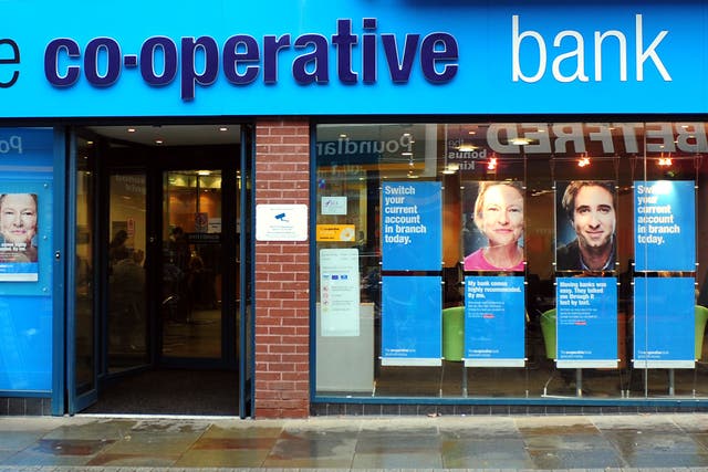 The Co-operative Bank has seen its yearly profit nearly halve (Rui Vieira/PA)