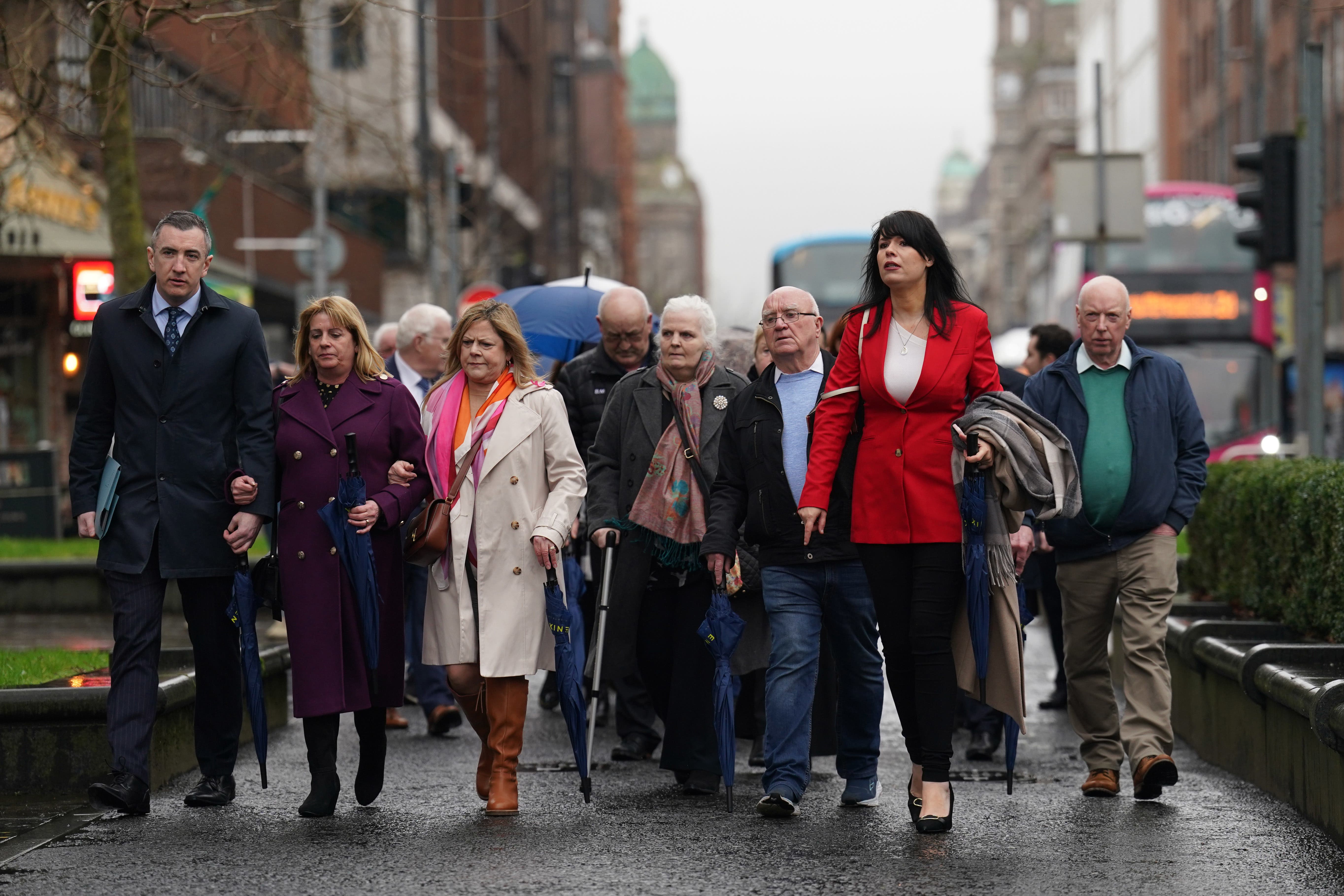 Grainne Teggart, Amnesty International UK’s Northern Ireland Deputy Director with victims families and supporters outside Belfast High Court (Brian Lawless/PA)