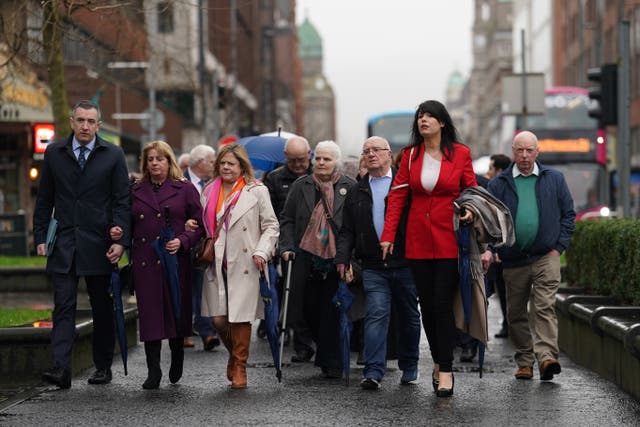 Grainne Teggart, Amnesty International UK’s Northern Ireland Deputy Director with victims families and supporters outside Belfast High Court (Brian Lawless/PA)