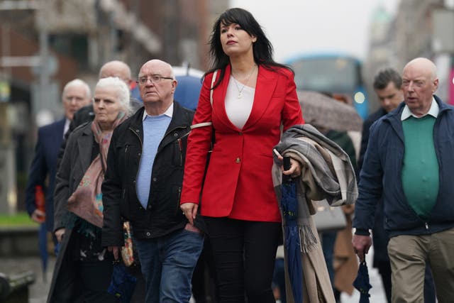 Grainne Teggart, Amnesty International UK’s Northern Ireland deputy director with victims’ families and supporters outside Belfast High Court (Brian Lawless/PA)