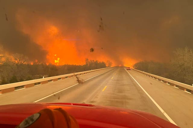 <p>A firetruck drives towards the Smokehouse Creek Fire, which is burning through 500,000 acres</p>