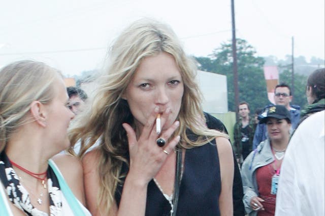 <p>Kate Moss, once rarely seen without a cigarette in hand, now rarely smokes</p>