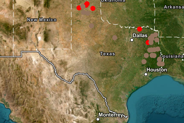 <p>Map of Texas showing where active fires are burning (red dots) and where blazes have been contained (brown dots)</p>