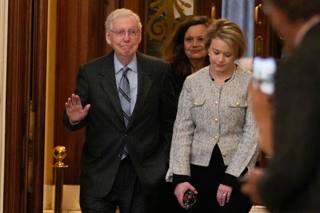 <p>Senate minority leader Mitch McConnell of Kentucky walks off the Senate floor after speaking on 28 February 2024 </p>
