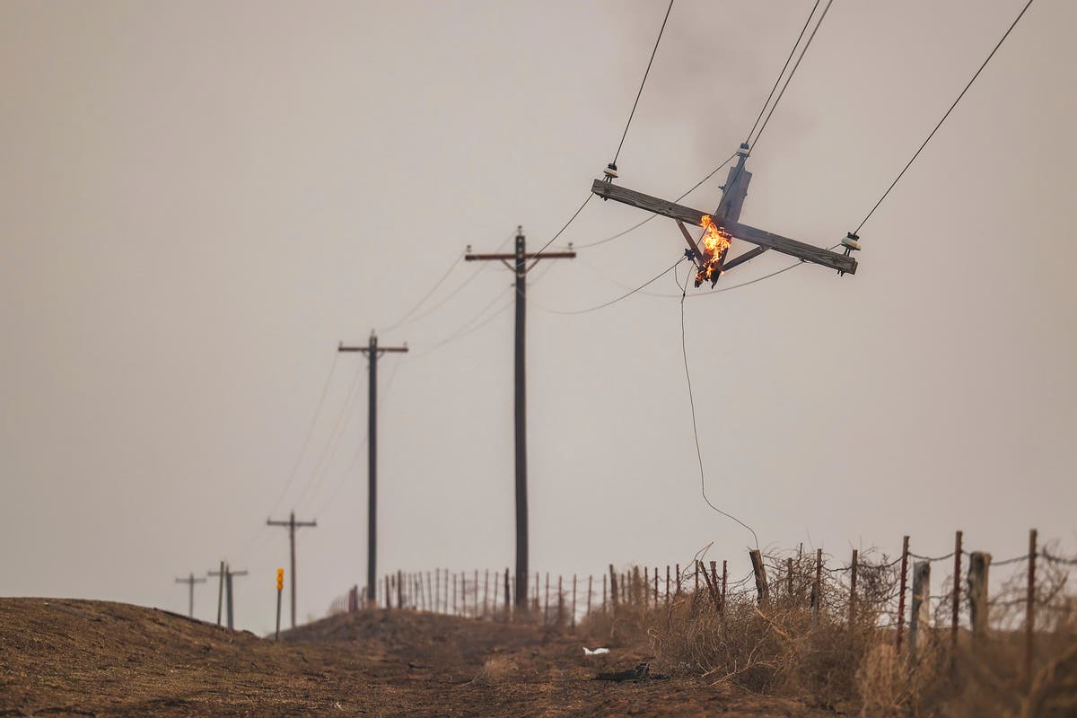 Flames menace multiple towns as wildfire grows into one of the largest in Texas history