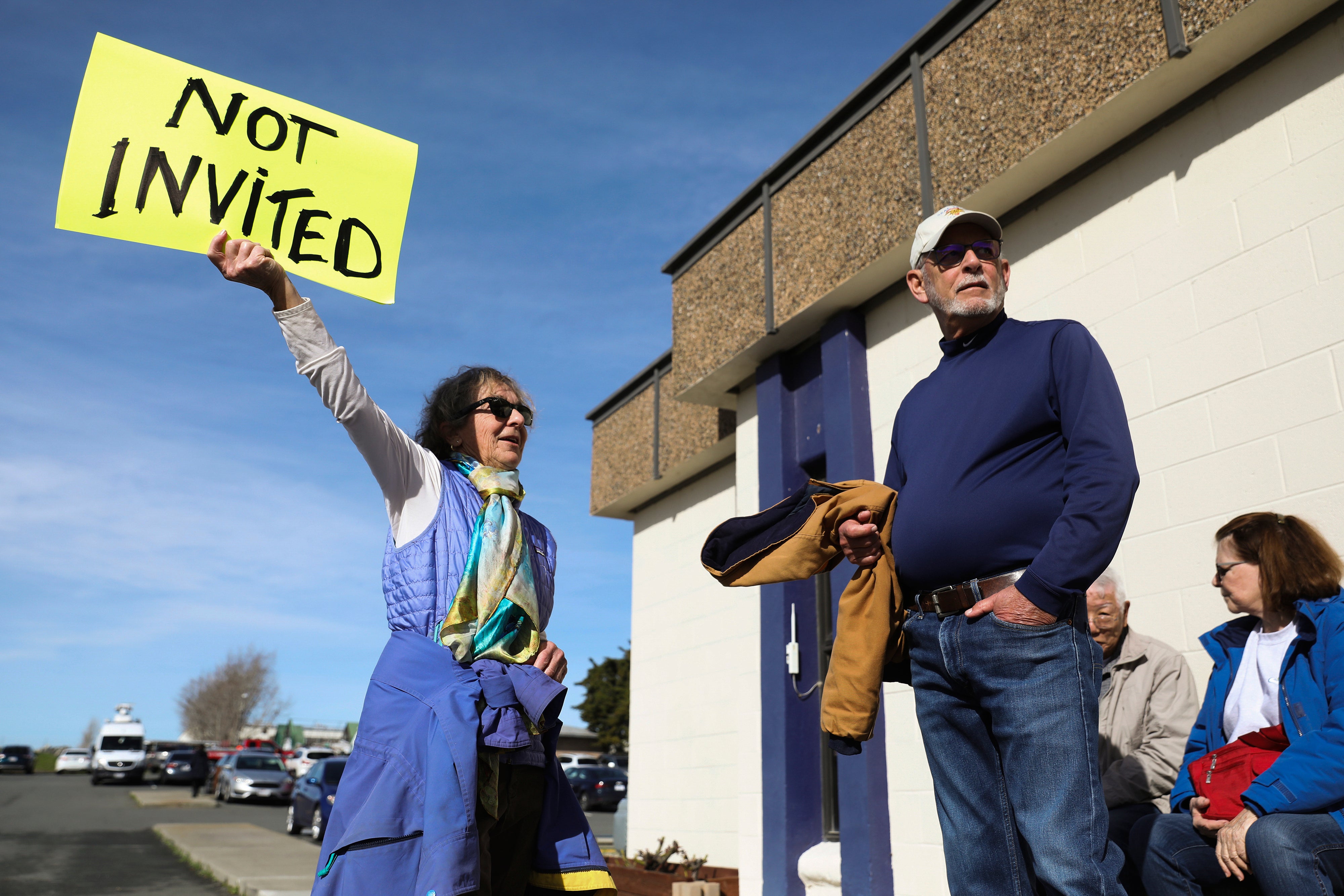 Solano County and Rio Vista residents Kathleen Threlfall, left, and Bill Mortimore protest outside a press conference unveiling California Forever's plans after being shut out of the event held in Rio Vista, Calif., Jan. 17, 2024