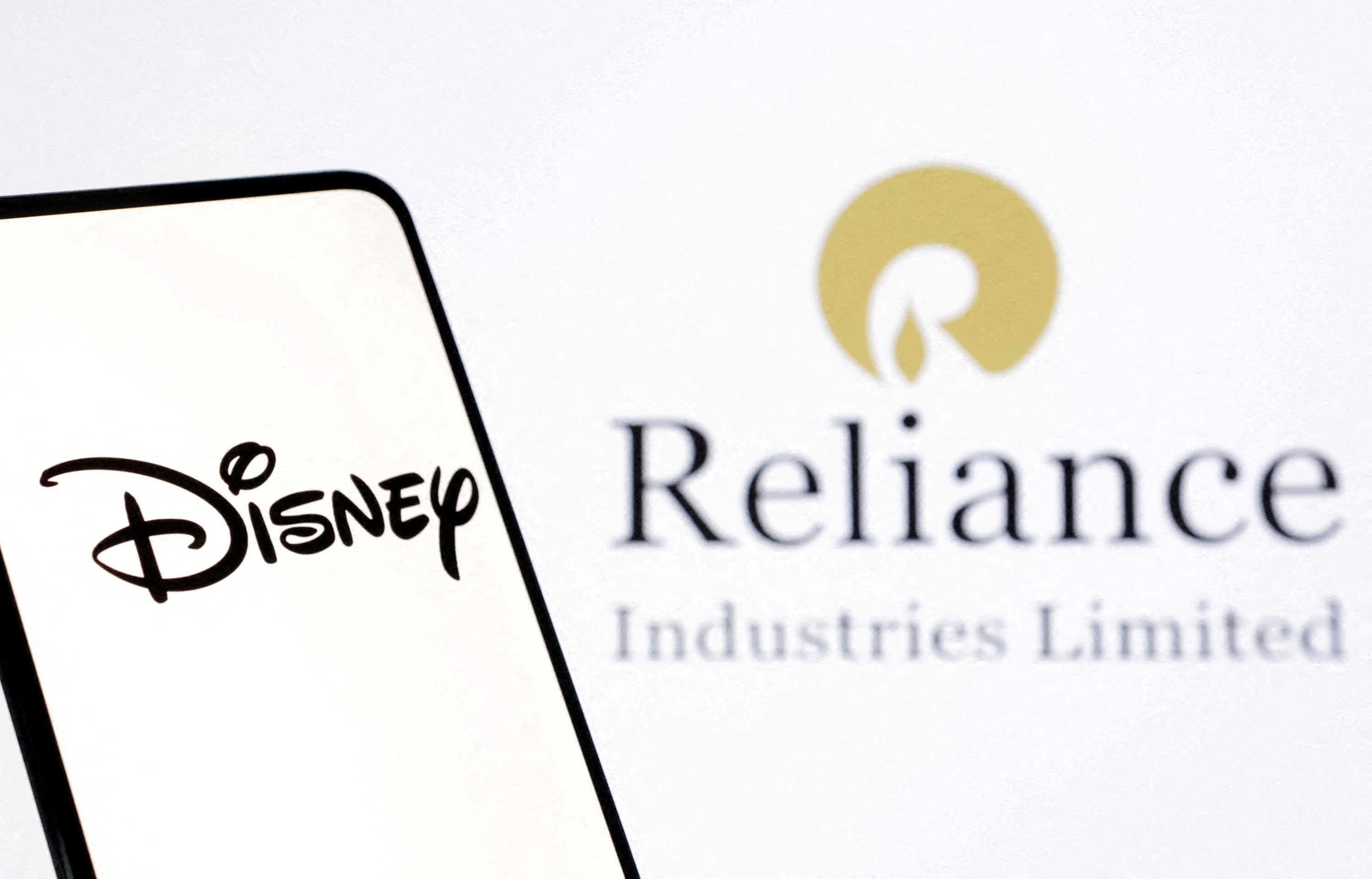 Illustration shows Disney and Reliance logos