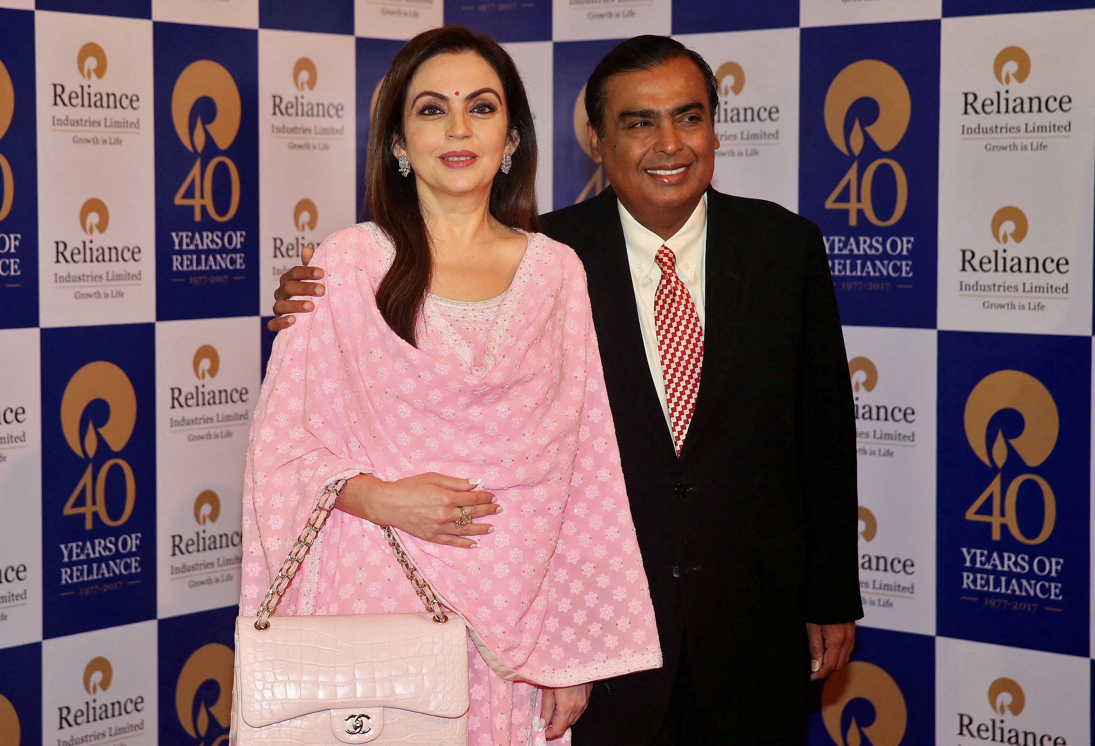 Mukesh Ambani, Chairman and Managing Director of Reliance Industries, poses with wife Nita Ambani before addressing the company’s annual general meeting in Mumbai, India 21 July 2017