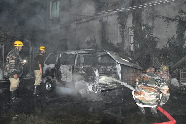 <p>Related: Firefighters douse a vehicle after it was set on fire by unidentified men following a bomb blast inside the office premises of the All Manipur Students’ Union, in Imphal, Manipur, India</p>