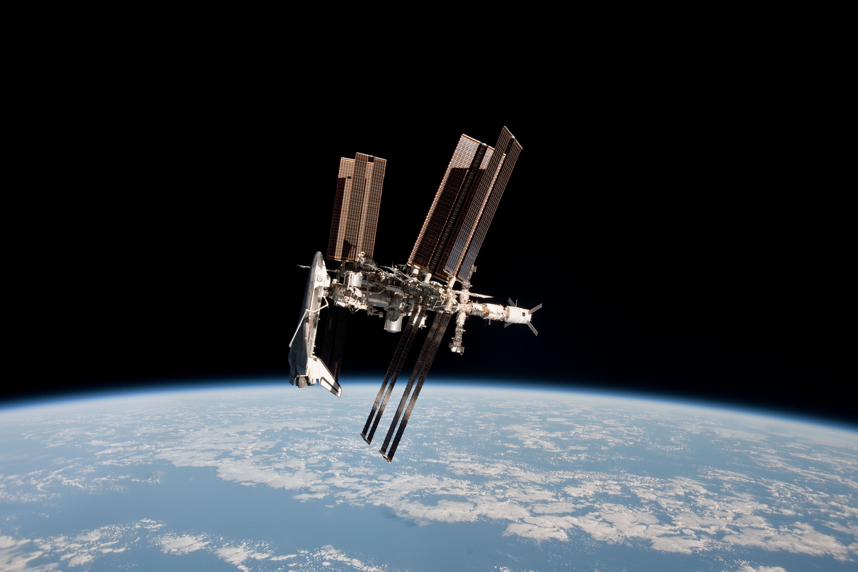 <p>In this handout image provided by the European Space Agency (ESA) and NASA, the International Space Station and the docked space shuttle Endeavour orbit Earth during Endeavour's final sortie on May 23, 2011 in Space</p>