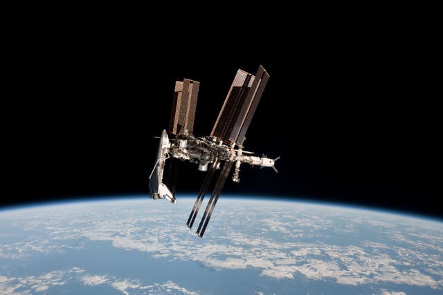 <p>In this handout image provided by the European Space Agency (ESA) and NASA, the International Space Station and the docked space shuttle Endeavour orbit Earth during Endeavour's final sortie on May 23, 2011 in Space</p>