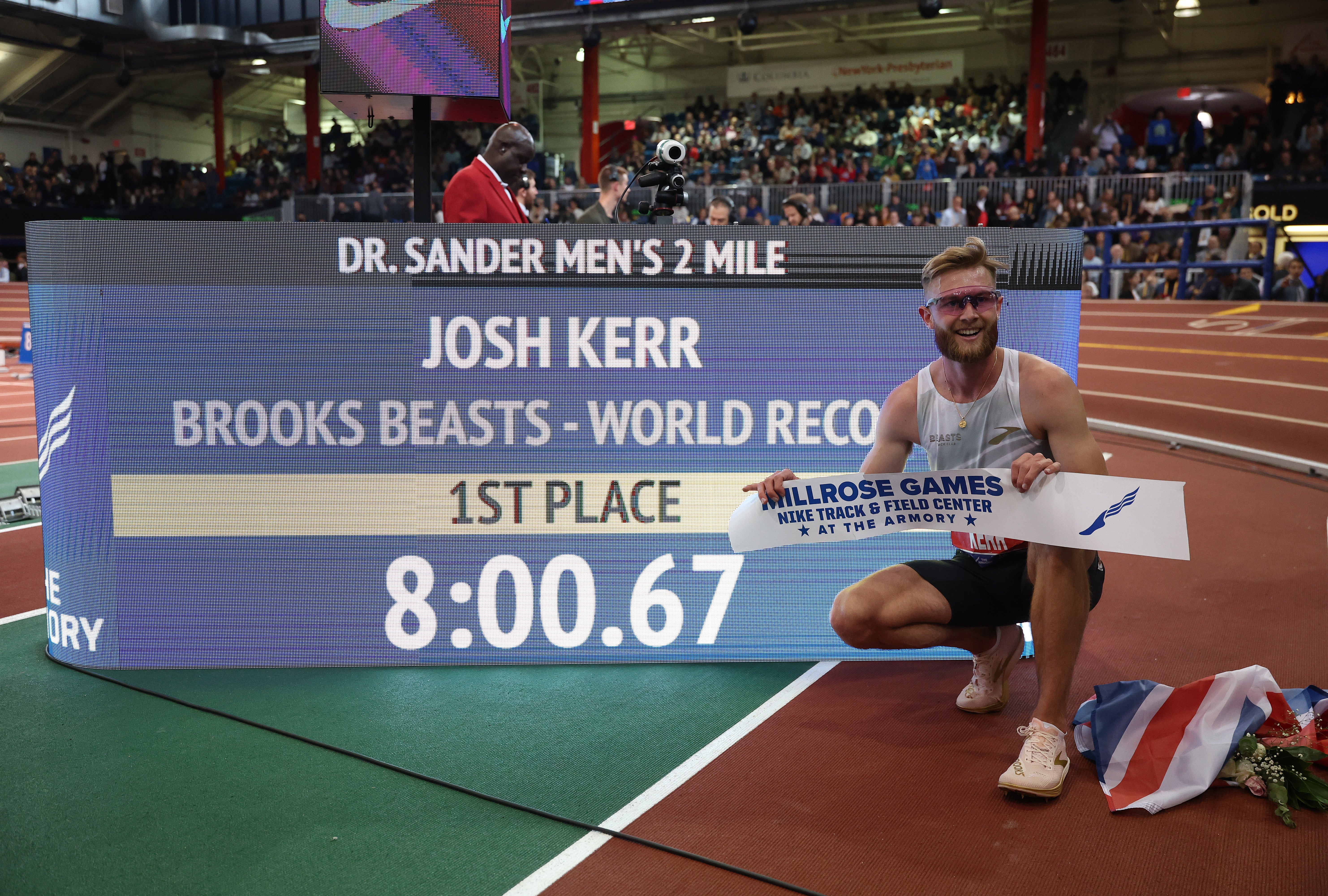 Kerr poses with his world-record time at the Millrose Games