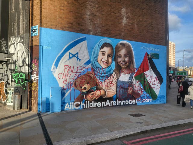 <p>The Israel-Gaza peace mural was defaced with graffiti just 16 days after it was unveiled</p>