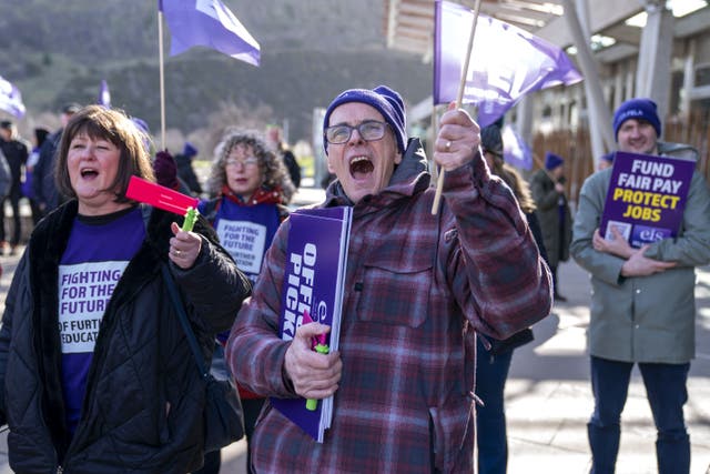 Striking college staff staged a rally outside Holyrood (Jane Barlow/PA)
