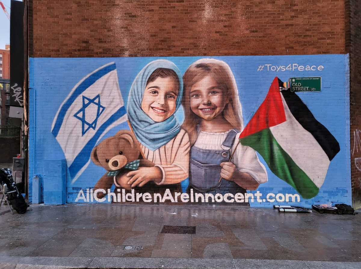 It was unveiled in Shoreditch and shows and Israeli and Palestinian child side-by-side