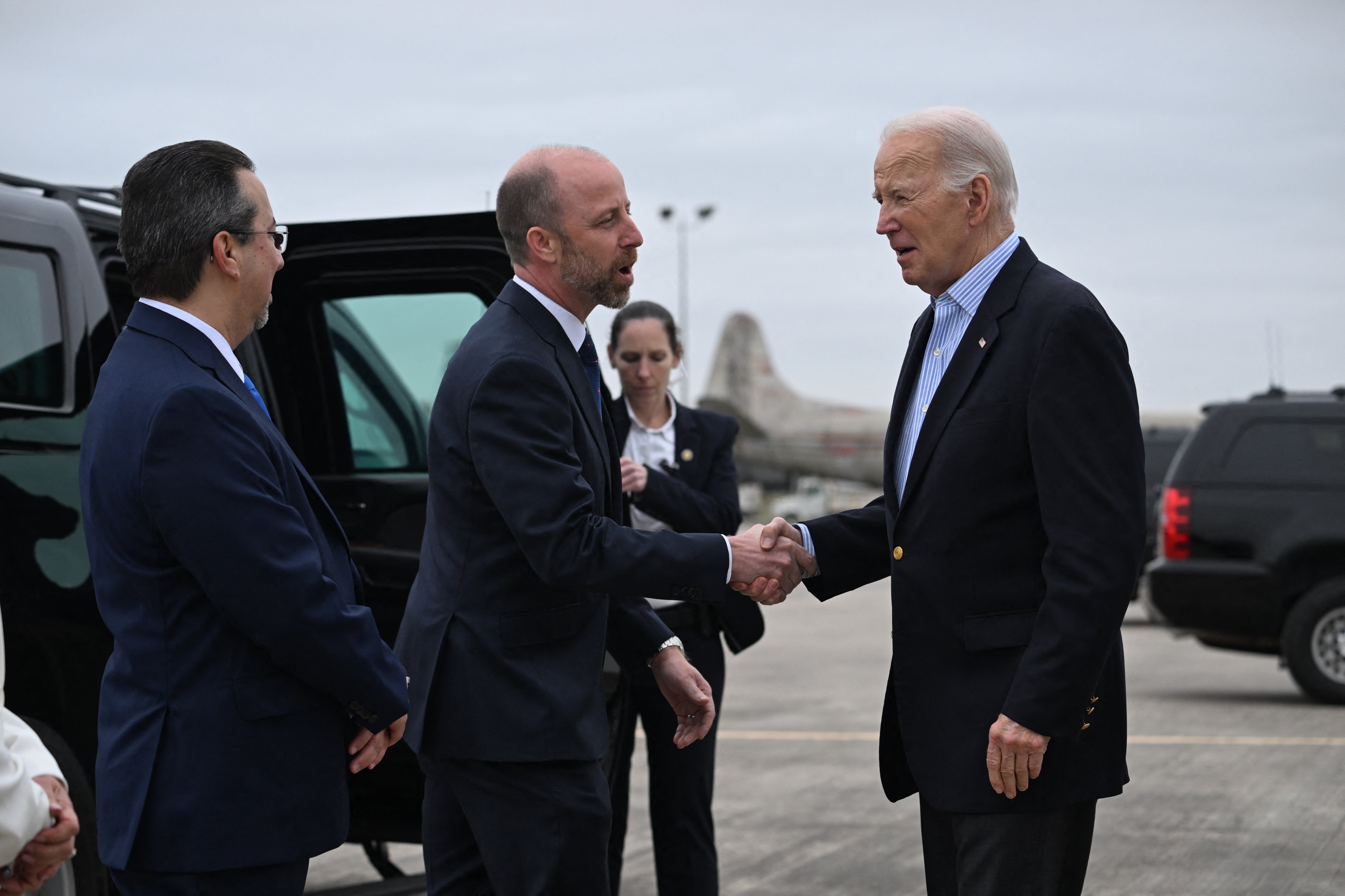 President Joe Biden is greeted by Brownsville Mayor John Cowen upon arrival at Brownsville South Padre Island International Airport in Texas