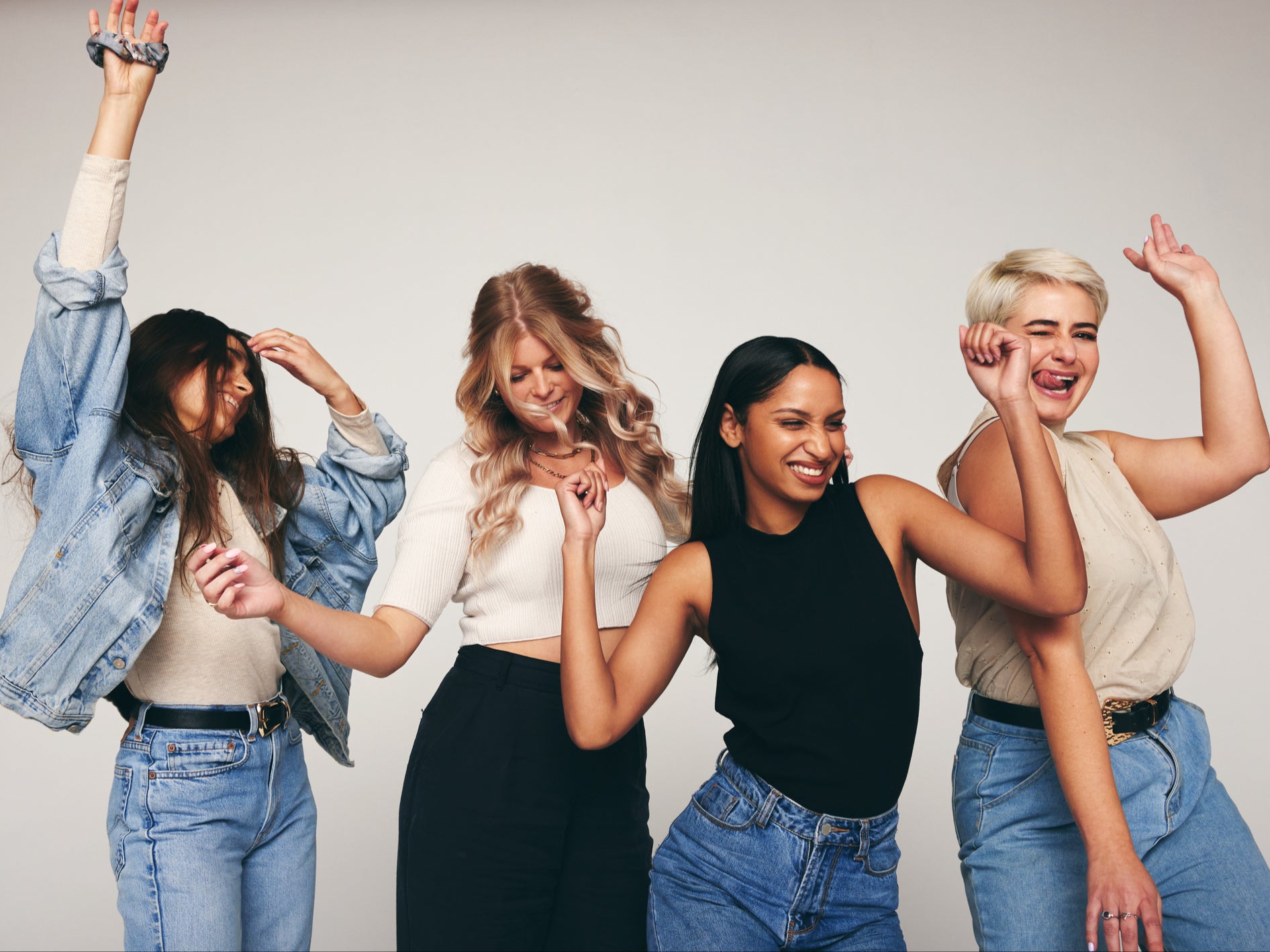 <p> Four happy women celebrating and having fun together.</p>