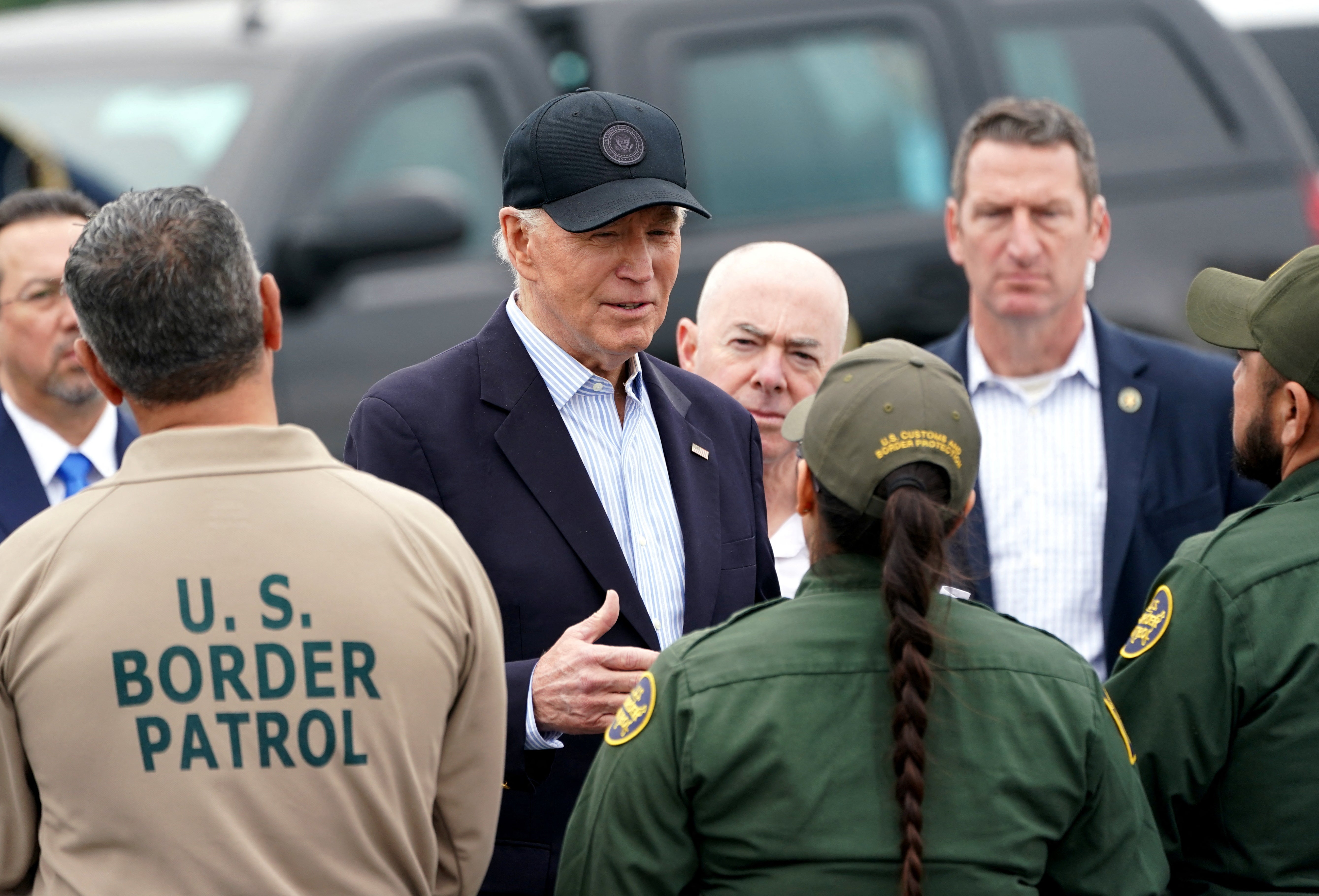 President Joe Biden, flanked by Homeland Security Secretary Alejandro Mayorkas, receives a briefing at the US-Mexico border in Brownsville, Texas