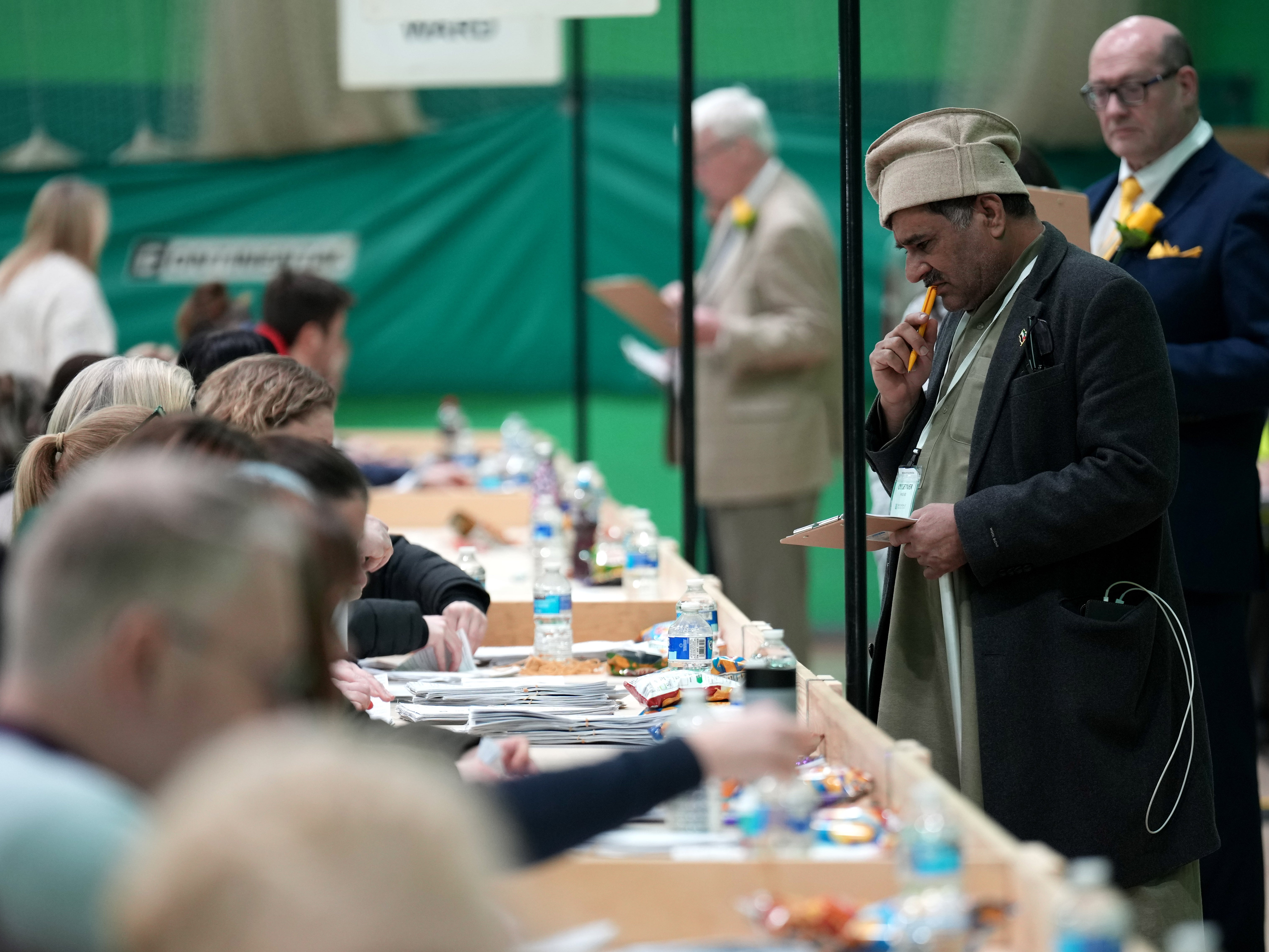 Officials count the votes in Rochdale after a chaotic and divisive campaign
