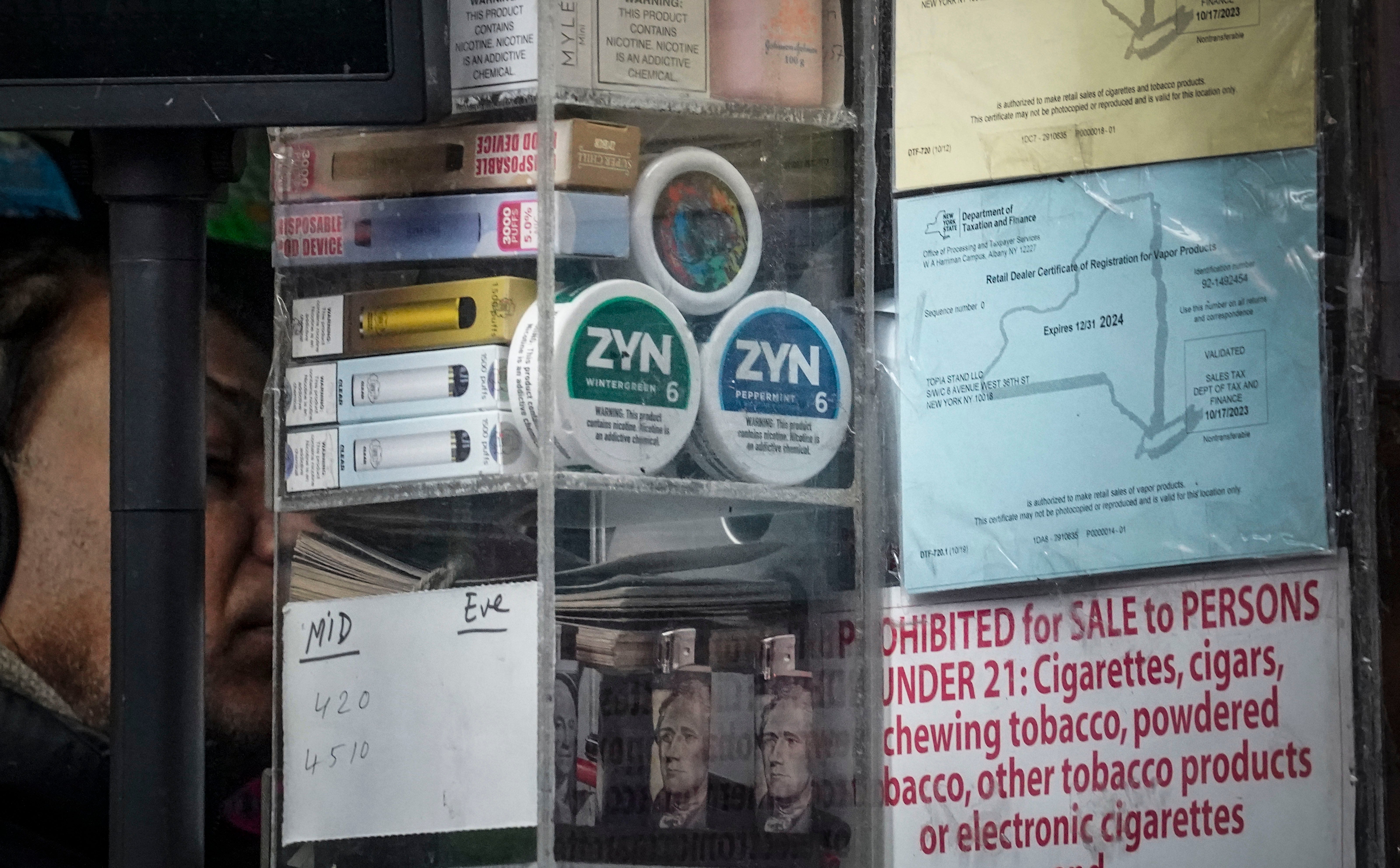 Containers of Zyn, a Phillip Morris smokeless nicotine pouch, is stacked for sale at a newsstand in New York