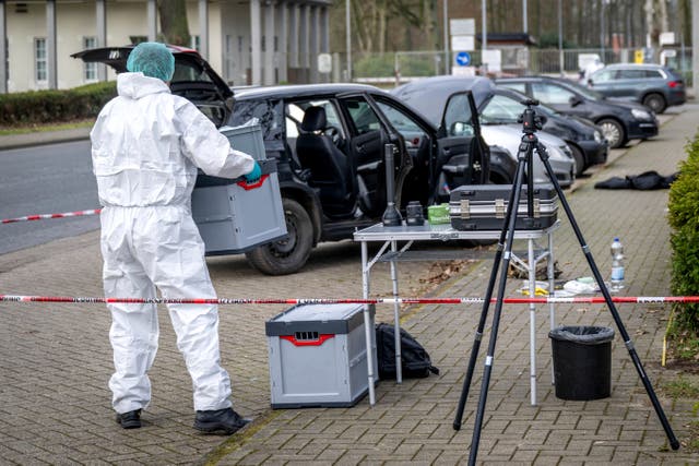 <p>A forensics officer works near a car in front of the Von D’ring barracks in Rotenburg</p>