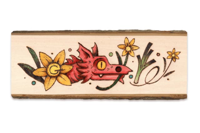 <p>The doodle depicts a Welsh red dragon holding a daffodil and includes a leek </p>