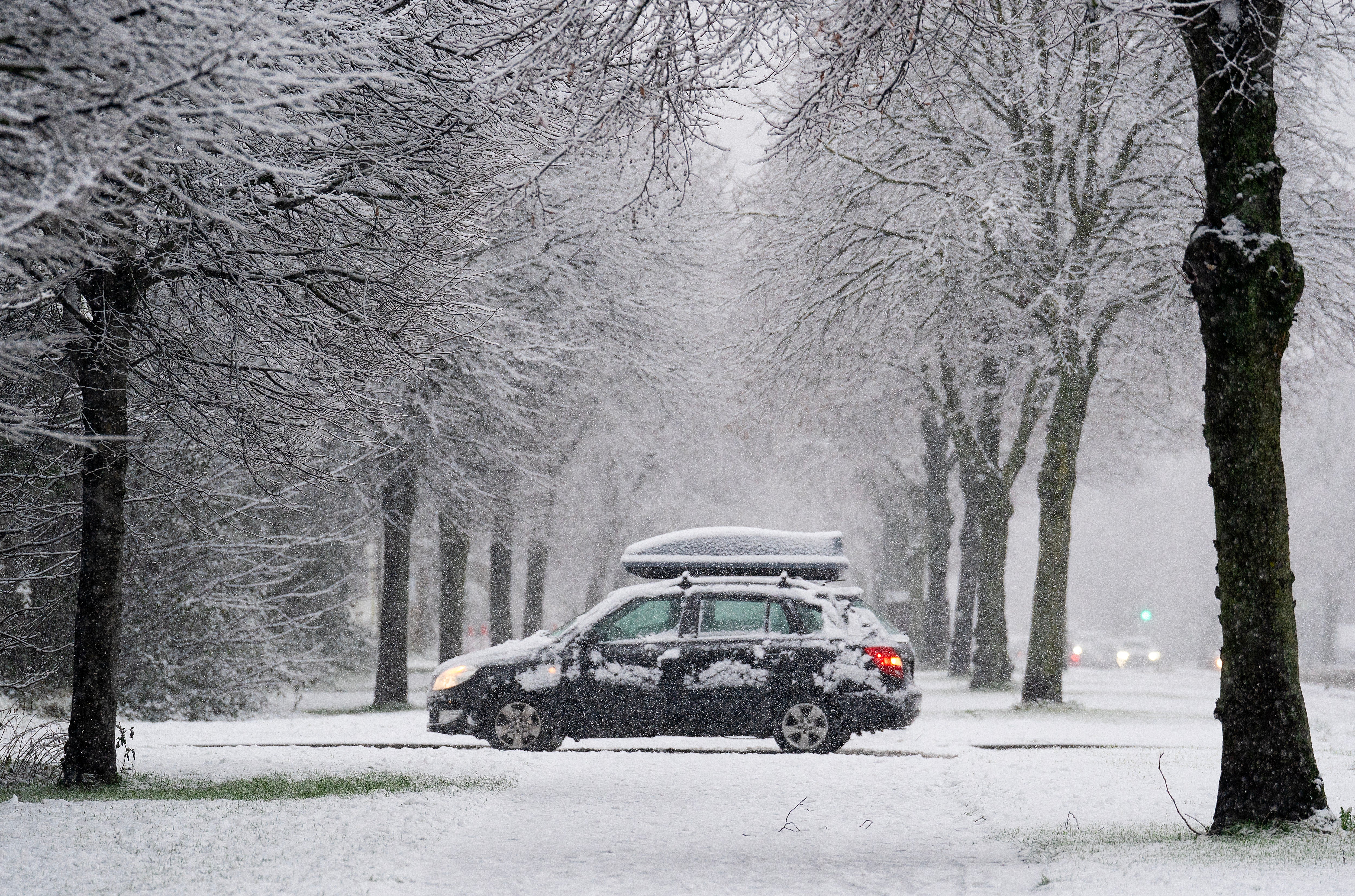 A car on Griffith Avenue as snow falls on the Northside of Dublin