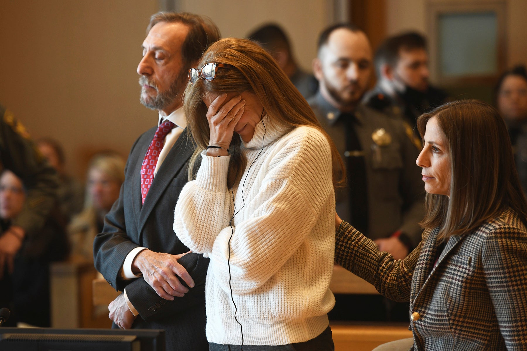 Michelle Troconis listens as a verdict of guilty on all counts is read on the final day jury deliberation for her criminal trial at Connecticut Superior Court in Stamford, Conn. Friday, March 1, 2024
