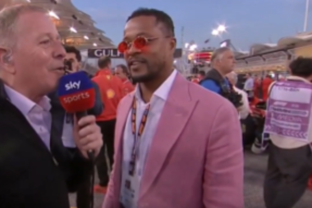 <p>Martin Brundle talking to Patrice Evra on the F1 grid in Bahrain </p>