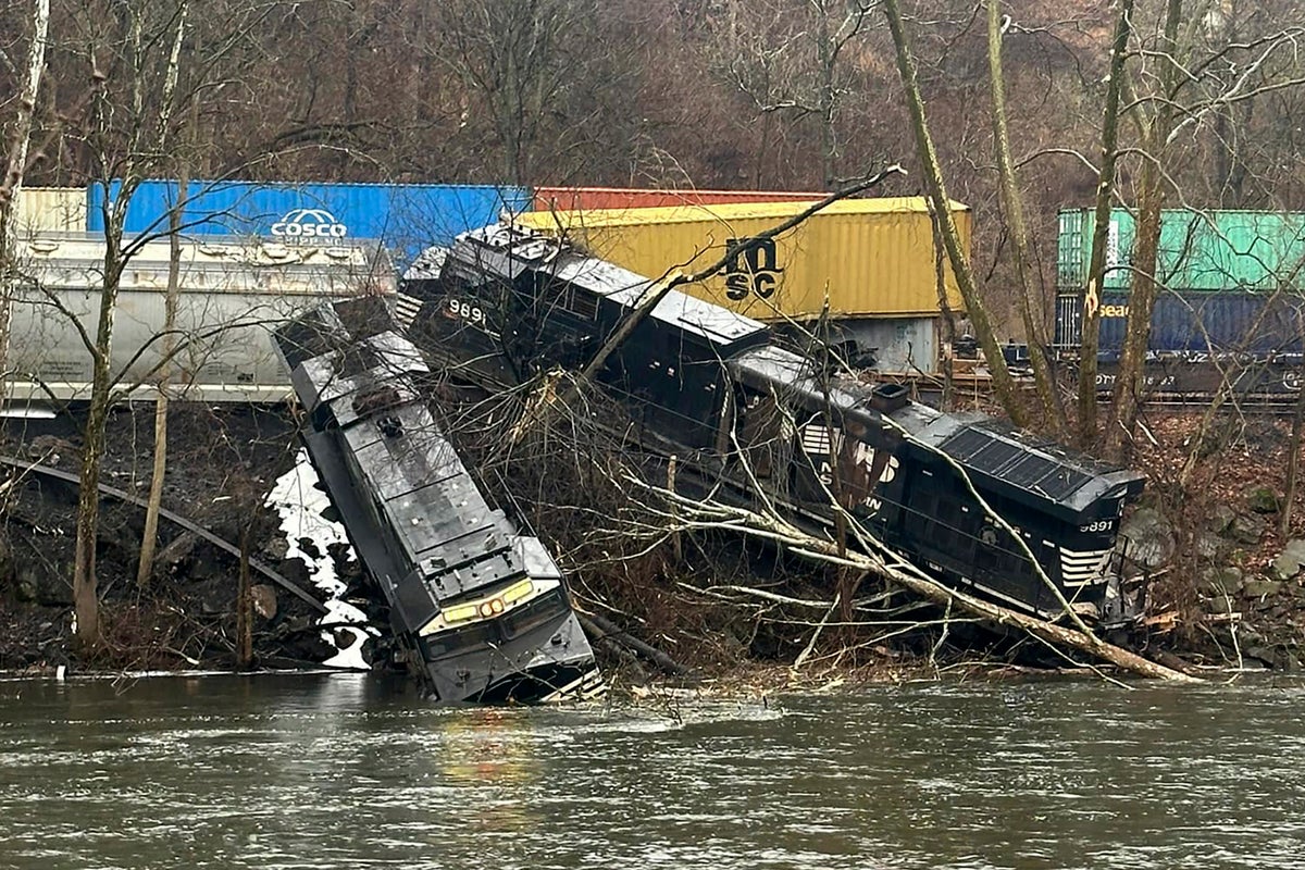 Train crews working on cleanup and track repair after collision and derailment in Pennsylvania