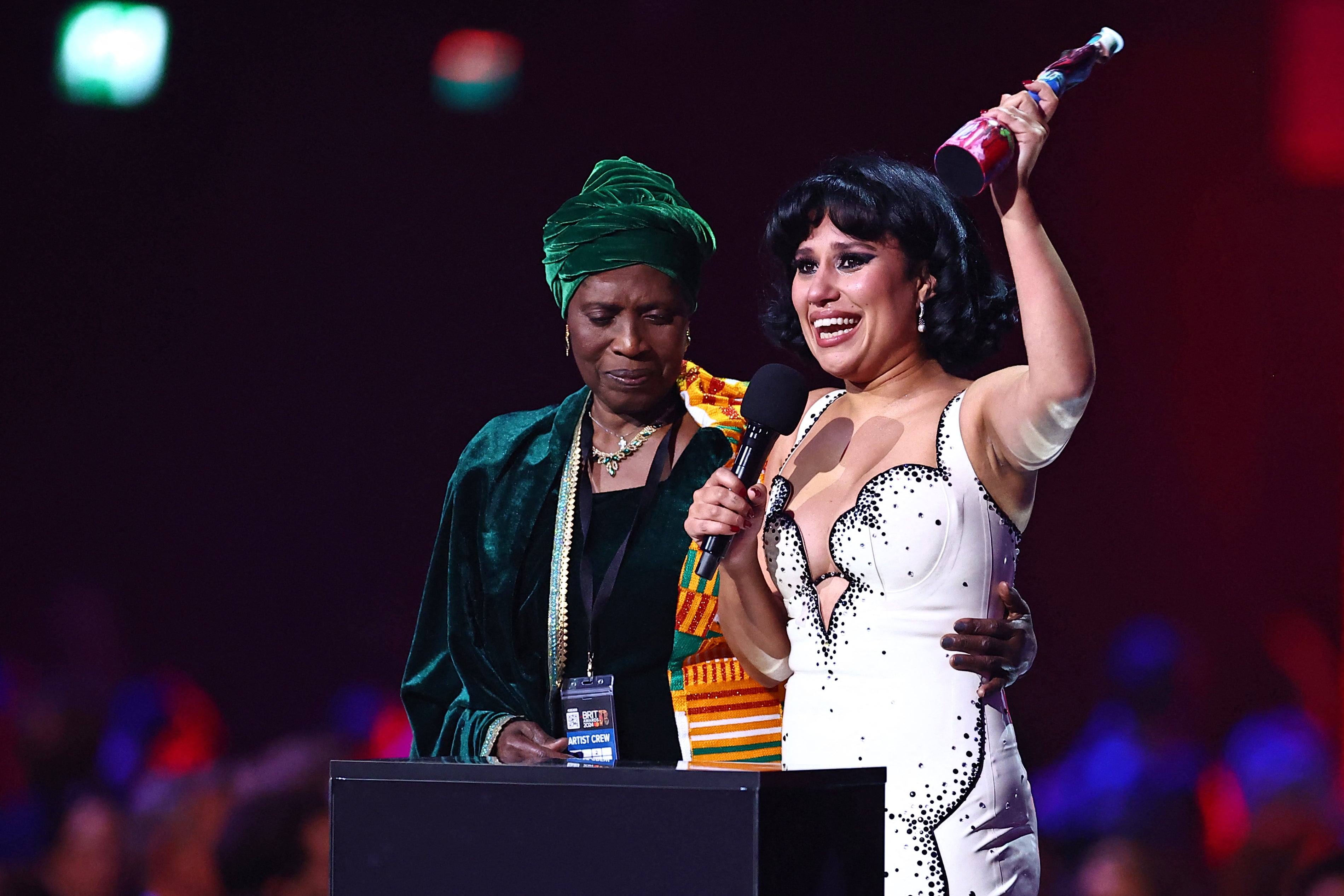 Raye on stage with her grandmother accepting the night’s top gong ‘Album of the Year’